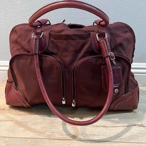 Tumi ballistic nylon and leather wine/burgundy tote or overnight bag. 18”x15”x7”
